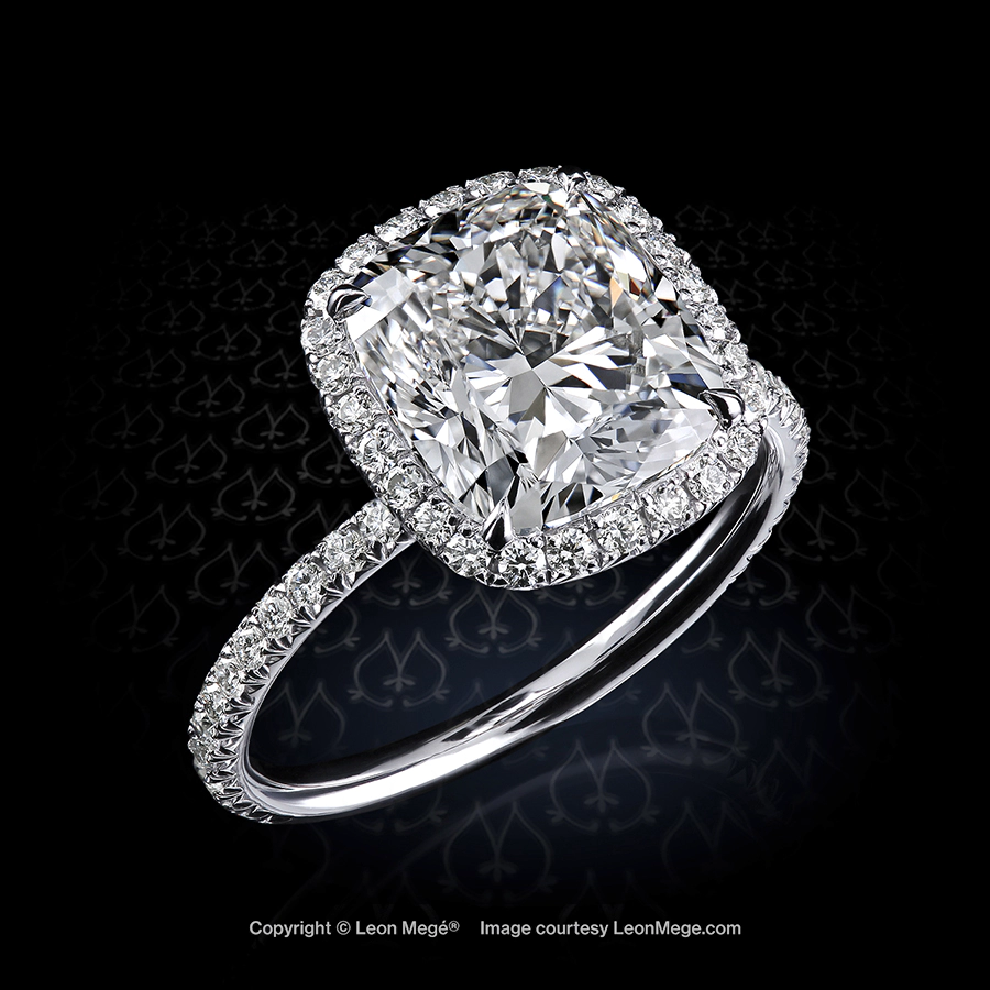 Micro pave halo ring featuring 2.5 carat cushion diamond in platinum by Leon Mege