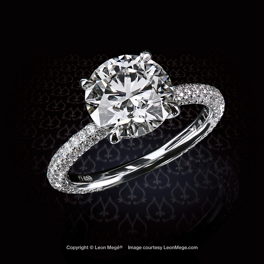 Solitaire engagement ring with a 2.43 carat round diamond set with micro pave in platinum by Leon Mege