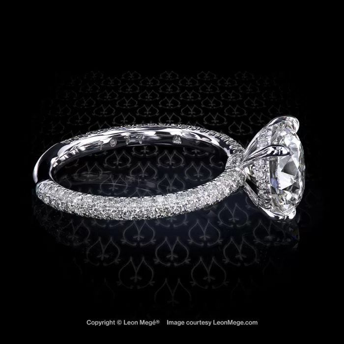 Solitaire engagement ring with a 2.43 carat round diamond set with micro pave in platinum by Leon Mege