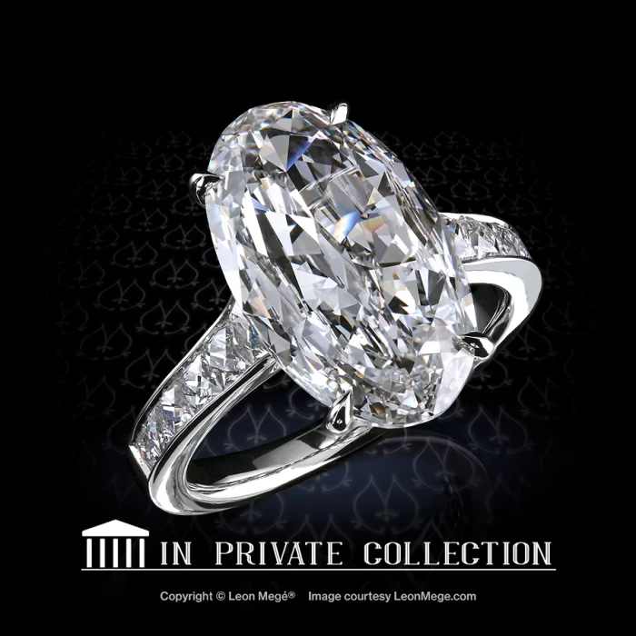 Custom made ring with 5.04 carat D/VS1 oval - moval diamond and layout of French cut diamonds by Leon Mege.