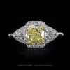 Leon Megé bespoke Montpassier™ ring with a fancy yellow Radiant-cut diamond flanked a pair of white diamond trillions in a miro pave frame r8047