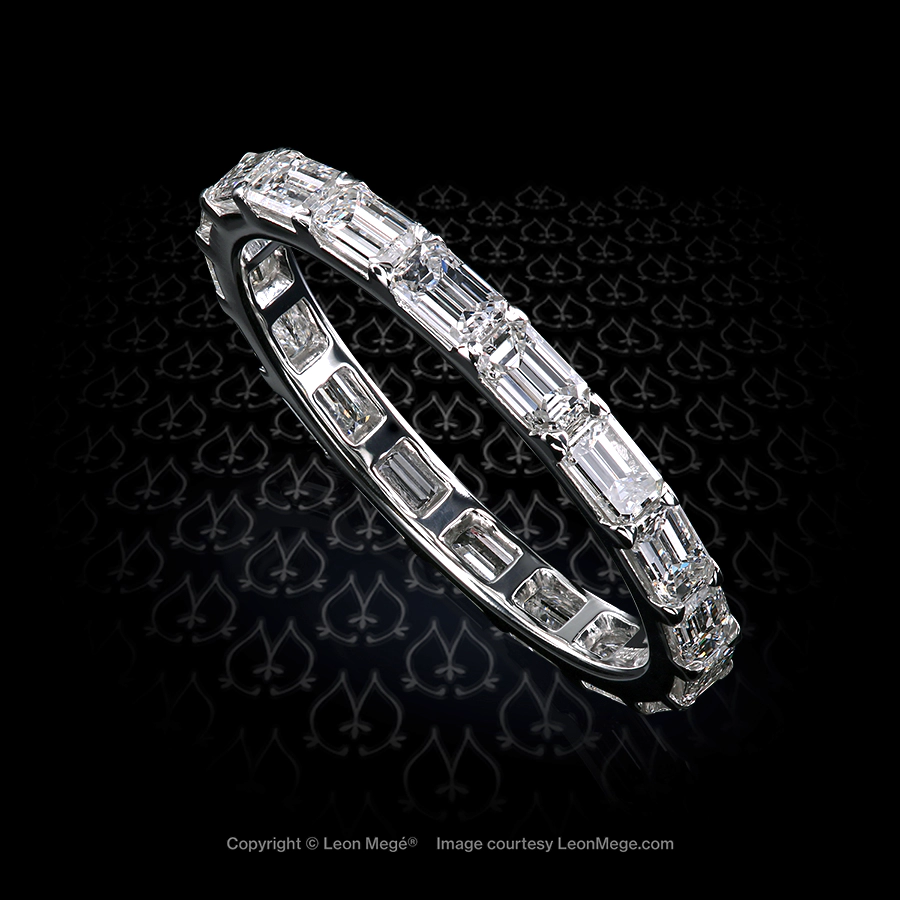 2 mm wide Eternity wedding band in platinum with east-west set emerald cut diamonds by Leon Mege