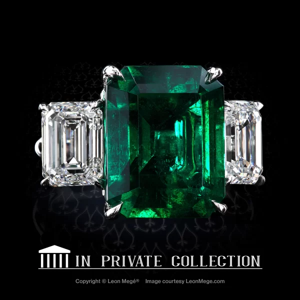 Bespoke handmade three-stone ring in platinum by Leon Mege set with Colombian green emerald gemstone and a pair of matching emerald cut diamond side stones