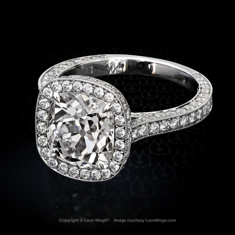 Heidy halo ring featuring a True Antique cushion diamond by Leon Mege.