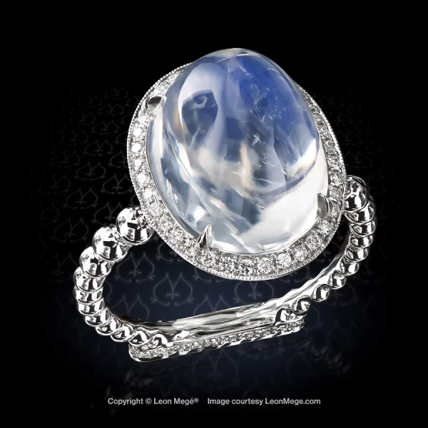 A rare blue moonstone cab in a diamond halo couture ring design by Maestro Mege r8225