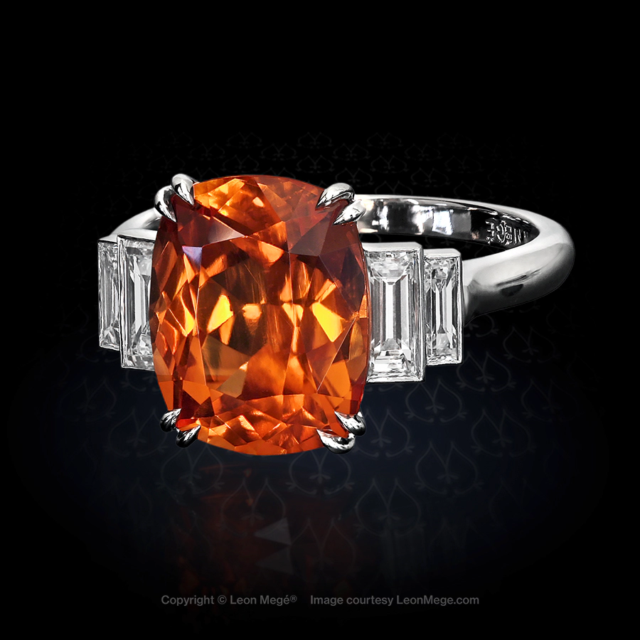 Platinum five-stone ring featuring 5.15 carat cushion orange garnet by Leon Mege.
