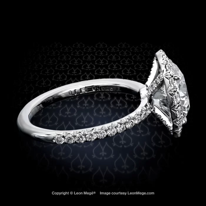 Round diamond pave engagement ring with halo by Leon Mege.