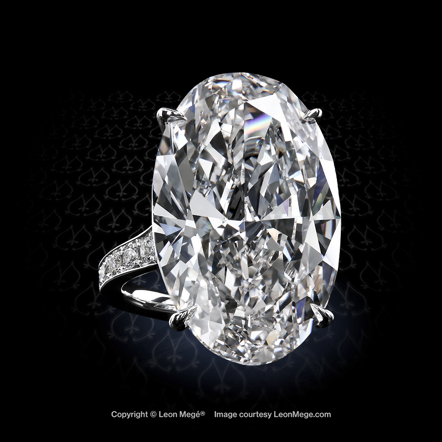 Leon Megé bespoke 311™ solitaire with an elegant oval diamond in single claws and bright-cut pave r7842