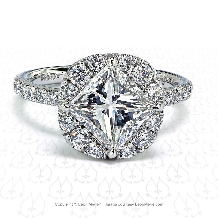 Princess cut diamond in a cushion halo set with micro pave by Leon Mege.