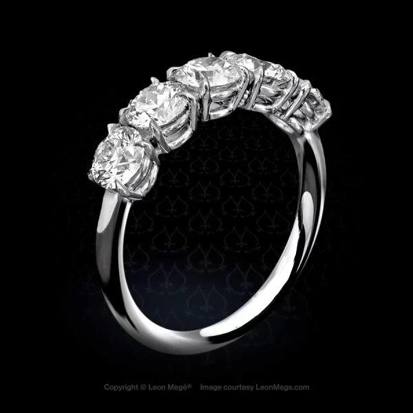 Custom-made band with five matching ideal cut diamonds in an elegant platinum mounting with single claw prongs r4152