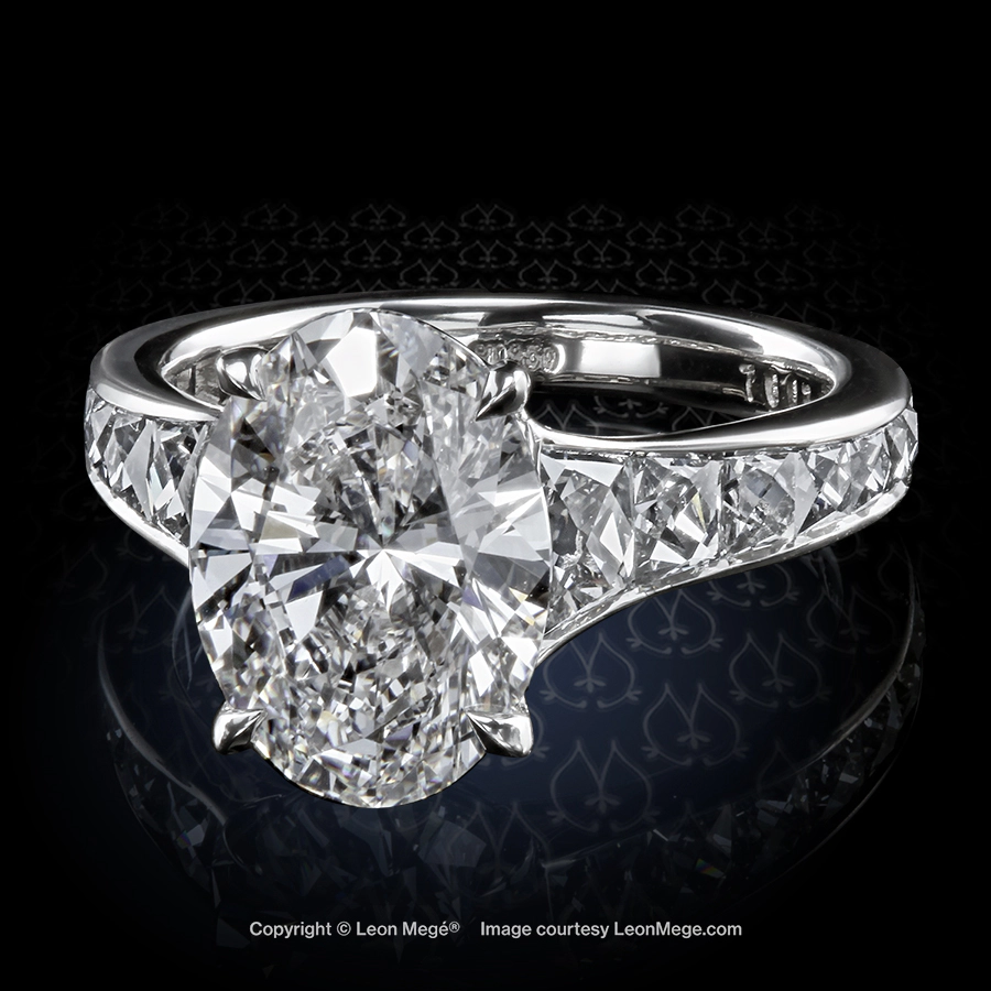 Leon Megé Mon Cheri™ solitaire with an oval diamond and graduated French cut diamonds r7603