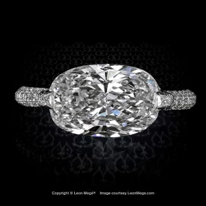 East-West diamond micro pave solitaire with cushion diamond and open back by Leon Mege