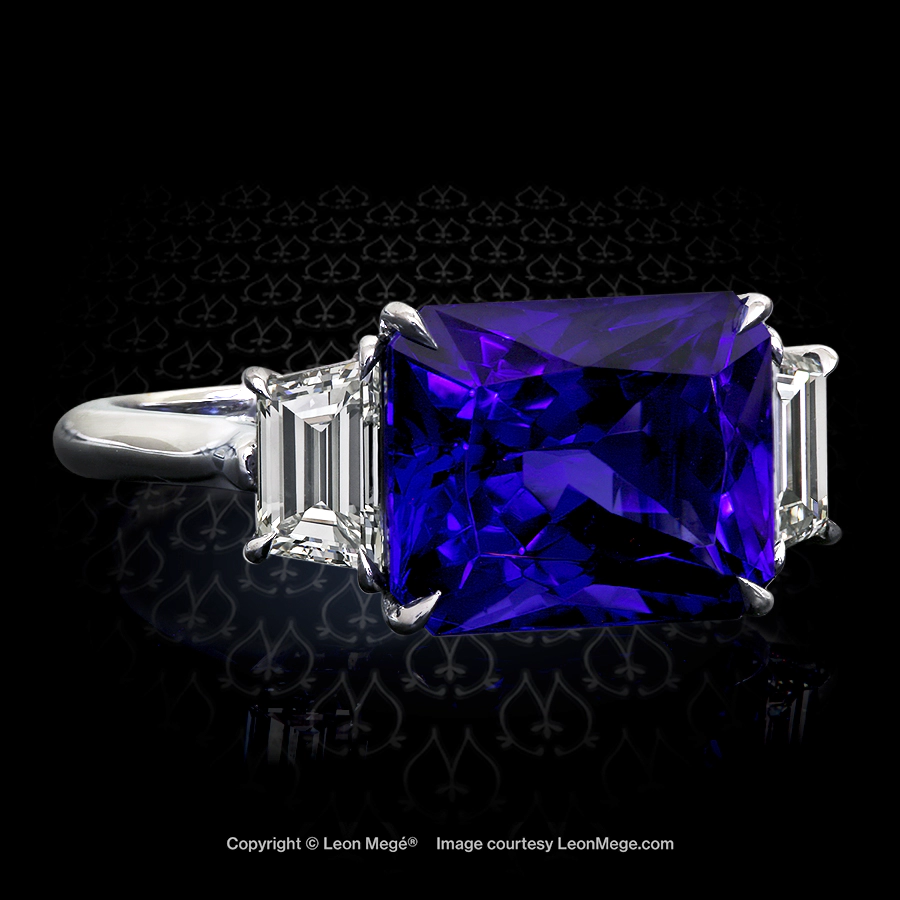 East -West set Tanzanite with diamond trapezoids in a three stone ring by Leon Mege