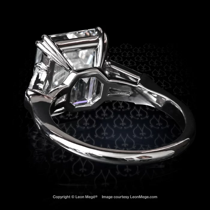 Classic three-stone ring, featuring 5.38 carat emerald cut diamond and tapered baguettes by Leon Mege.