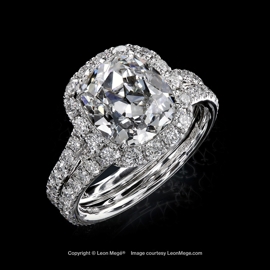 True Antique diamond halo ring with micro pave on a double shank by Leon Mege
