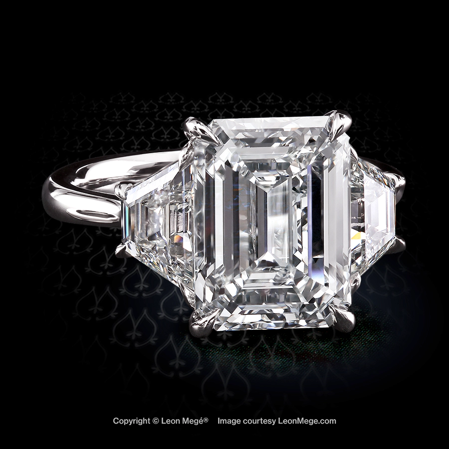 Leon Mege bespoke three-stone ring with emerald cut diamond and trapezoids
