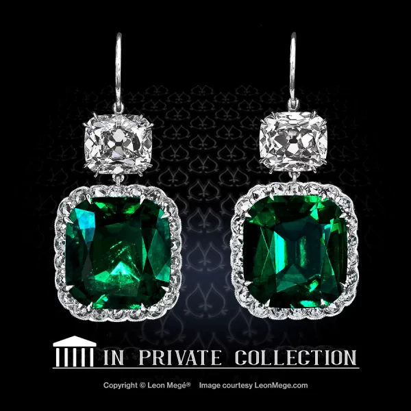 Earrings with a pair of olombian cushion cut vivid-green emeralds hanging off True Antique cushion diamonds