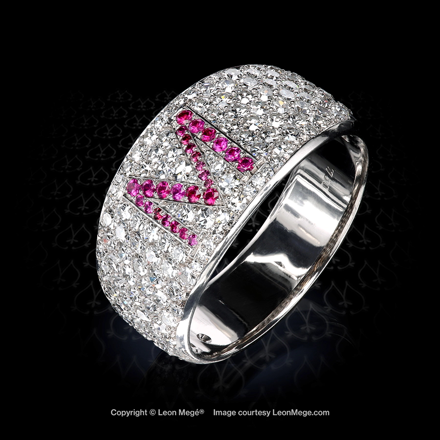 Low profile signet band set with single-cut diamonds and ruby-set M-initial by Leon Mege