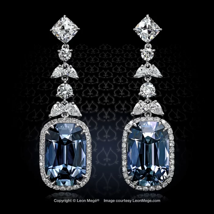 Distinctive platinum drops flaunt exquisite color-changing sapphires of a steely blue hue similar to the famed Hope diamond in micro-pave halos.