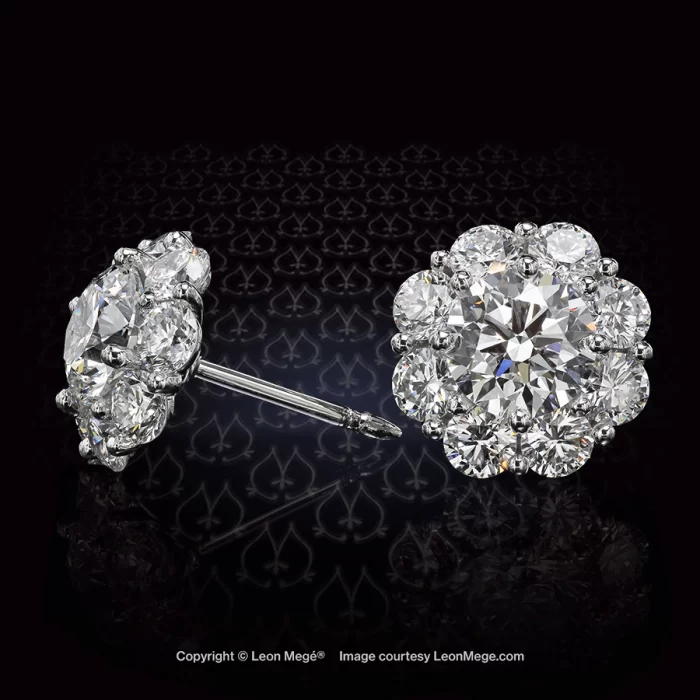 Custom made cluster earrings with 16 ideal-cut diamonds surrounding two center stones approximately one carat each.