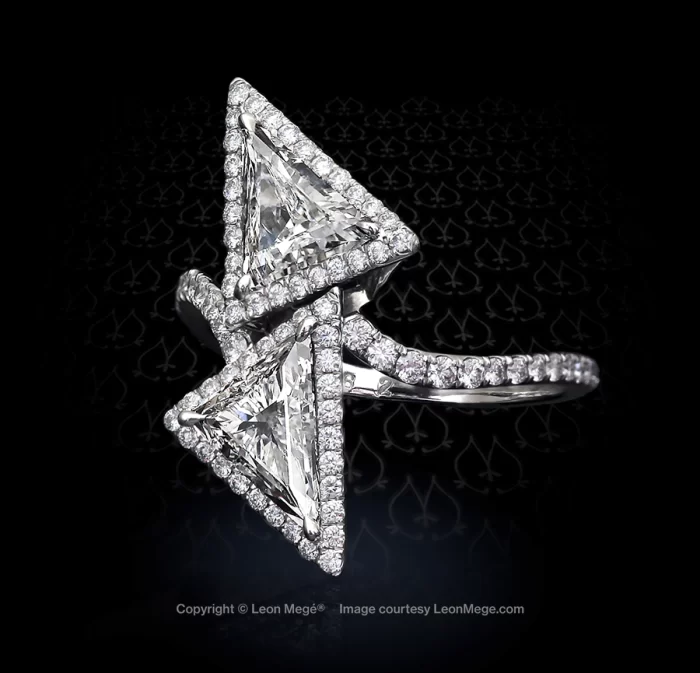 Leon Mege platinum bypass ring with fancy-shaped triangular diamonds roughly 2 carats each surrounded by micro pave.