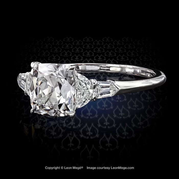 Classic five-stone ring, featuring 2.05-carat True Antique™ cushion diamond with half-moons and bullets.