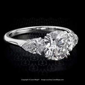 Leon Mege classic three-stone ring, featuring 2.01 carat round diamond and pear shapes