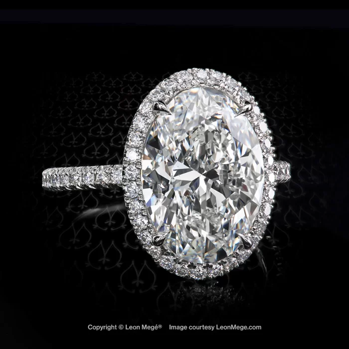 Leon Megé exclusive 811™ halo ring in platinum featuring an oval diamond r8129