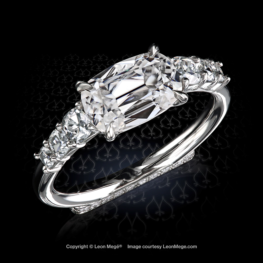 Leon Mege East-West solitaire ring features rare True Antique cushion Blonde moissanites and natural diamonds on the Podium™ base.