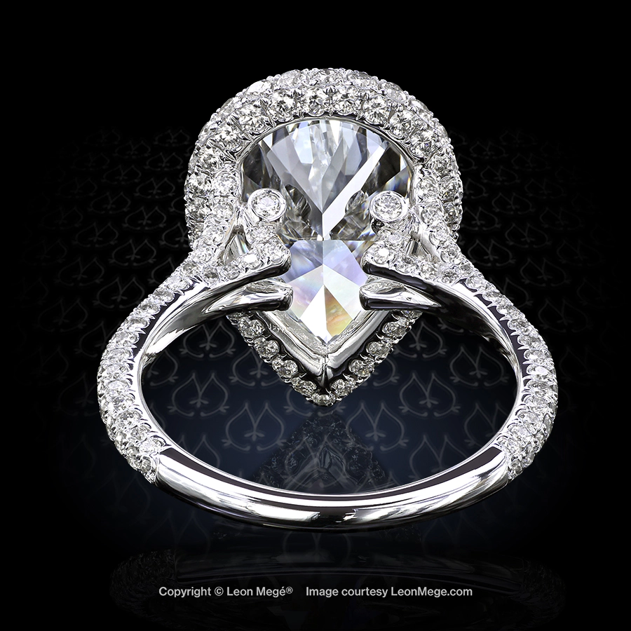 Leon Megé bespoke engagement ring with a pear-shaped diamond in a micro pave halo r7114