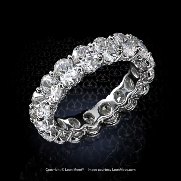 Elegant shared-prong eternity band with natural oval diamonds approximately 0.25-carat each.