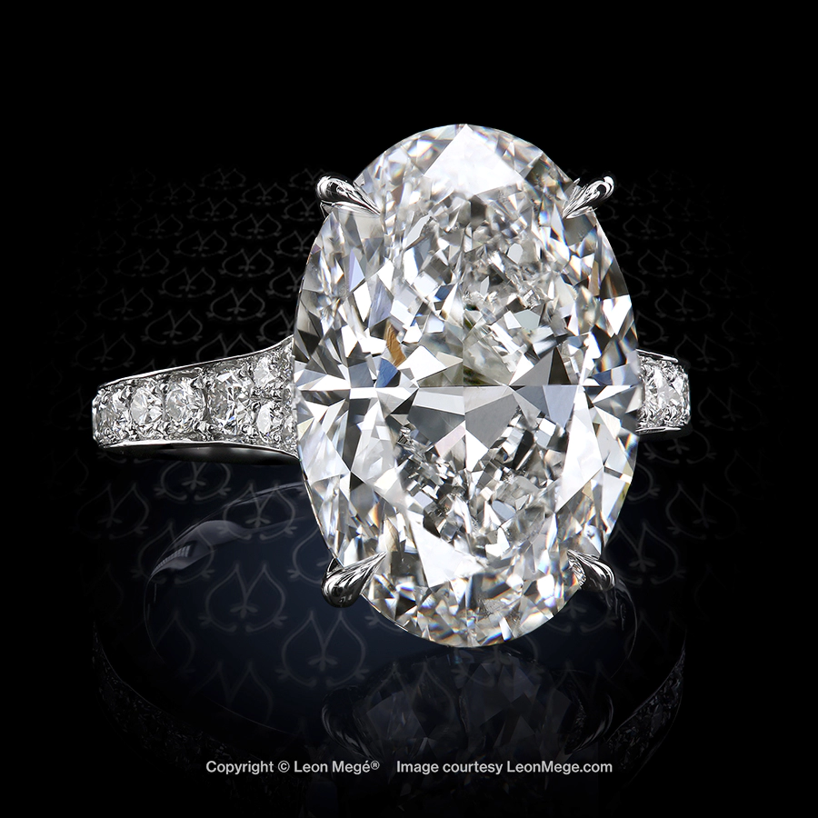Leon Megé stunning solitaire with an oval diamond and bright-cut diamond pave r7892