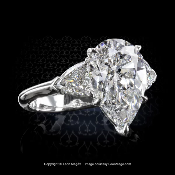 Leon Megé three-stone ring with a pear shaped diamond and a pair of Heater shield side stones r7556