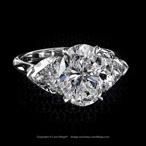 Leon Megé three-stone ring with an oval diamond and a pair of matching heart-shaped diamonds r7826