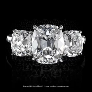 Bespoke three-stone ring with True Antique™ cushion diamonds in a hand-forged platinum mounting with a spring r8571
