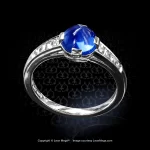 Leon Megé platinum right-hand ring with a natural sugarloaf cabochon Kashmir sapphire and channel-set French cut diamonds.
