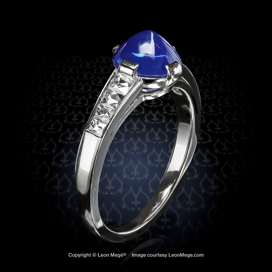 Leon Megé platinum right-hand ring with a natural sugarloaf cabochon Kashmir sapphire and channel-set French cut diamonds.