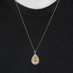 Leon Mege pendant with a rare certified fancy-color Calvados pear-shaped diamond round diamonds and single-cut natural pink diamonds p7809