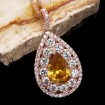 Leon Mege pendant with a rare certified fancy-color Calvados pear-shaped diamond round diamonds and single-cut natural pink diamonds p7809