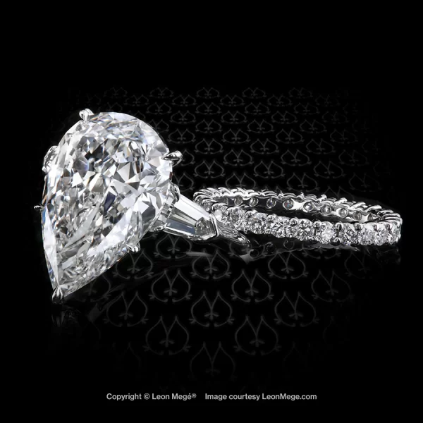 Leon Megé three-stone ring with a pear-shape diamond and bullets r7904