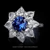 Leon Megé cluster ring with a round sapphire and pear shaped diamonds in a platinum basket r8678