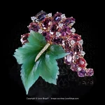 Leon Mege Grand Cru brouch in 18K yellow gold , diamond and purple oval spinels on a bed of nephrite leaf carving p8693