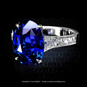 Leon Mégé Mon Chéri ring with a natural Royal-blue sapphire embraced by four claw prongs and a graduated channel of French-cut trapezoid diamonds r8736
